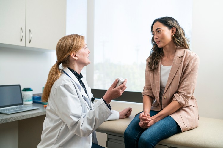 A patient talking to their doctor